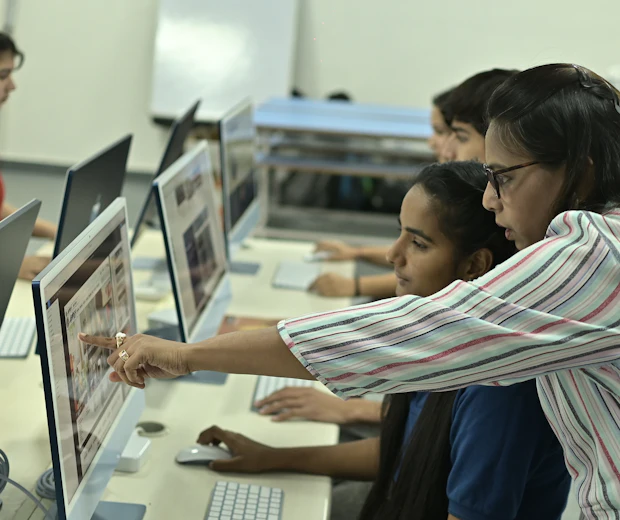 A tutor guiding students
